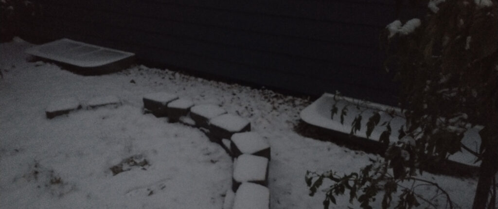 Picture of snow on top of new window well covers